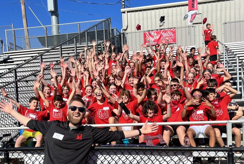 Maddux students cheer in the stands during 6th Grade Olympic Day